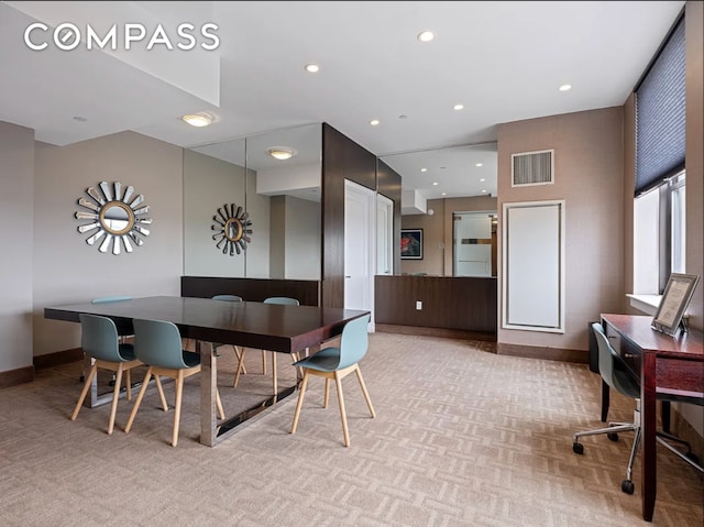 dining room featuring light colored carpet, recessed lighting, visible vents, and baseboards