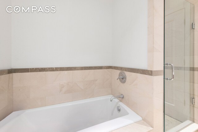 1 Hanson Pl Unit 15M, New York City, NY 11243 - full bath featuring a stall shower, a bath, and pet washing station