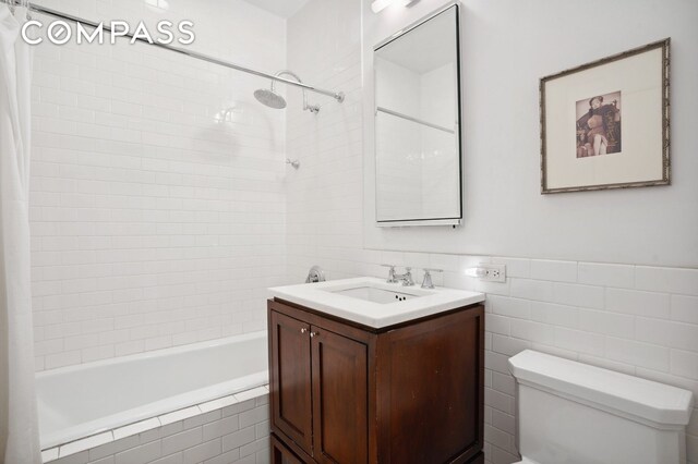 1 Hanson Pl Unit 15M, New York City, NY 11243 - full bathroom with tiled shower / bath combo, tile walls, and vanity