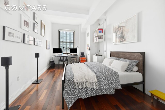 1 Hanson Pl Unit 15M, New York City, NY 11243 - bedroom with wood finished floors and a desk
