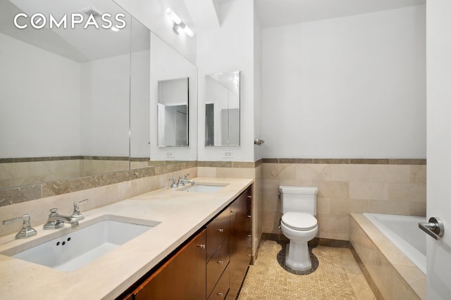 full bathroom featuring double vanity, a sink, toilet, and tile patterned floors