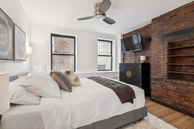 bedroom with ceiling fan and wood finished floors