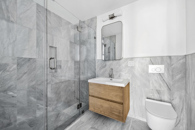 bathroom featuring a stall shower, tile walls, vanity, and toilet