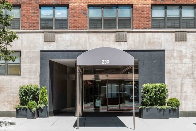 entrance to property with brick siding