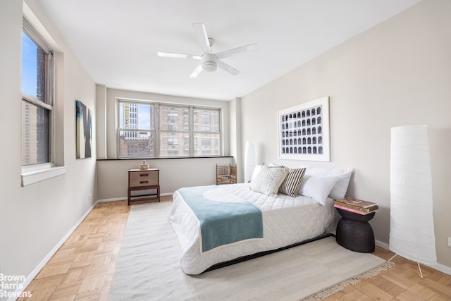 bedroom featuring ceiling fan and baseboards