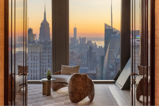 living area with a wall of windows and a city view