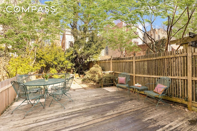 deck with fence private yard and outdoor dining area