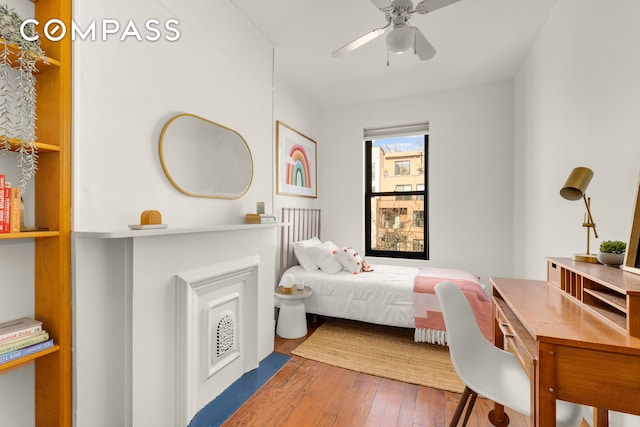 bedroom featuring hardwood / wood-style flooring and ceiling fan