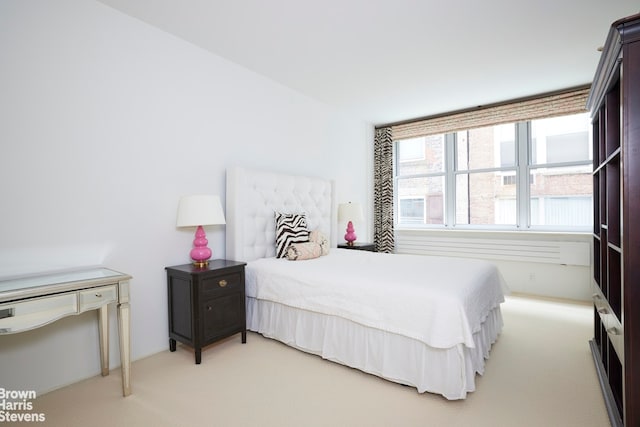 bedroom with light colored carpet