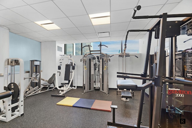 workout area with a paneled ceiling