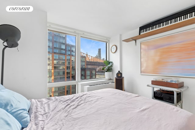 bedroom featuring a city view