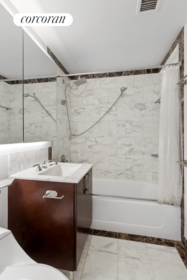 full bathroom with visible vents, toilet, marble finish floor, vanity, and shower / bathtub combination with curtain