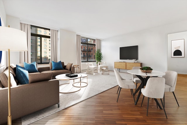 living area with hardwood / wood-style flooring