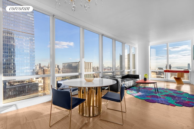 sunroom featuring a city view