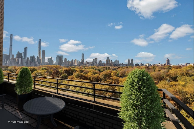 balcony featuring a city view