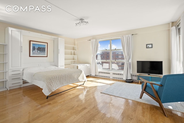 bedroom with wood finished floors