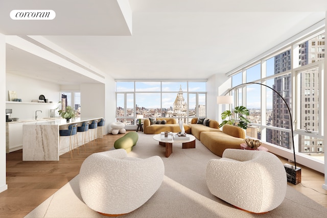 sunroom with a view of city and visible vents