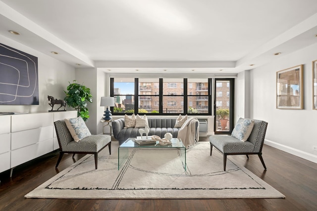 living room featuring baseboards and wood finished floors