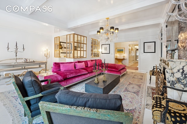 living area featuring beamed ceiling, a notable chandelier, and ornamental molding