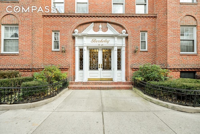 entrance to property with french doors and brick siding