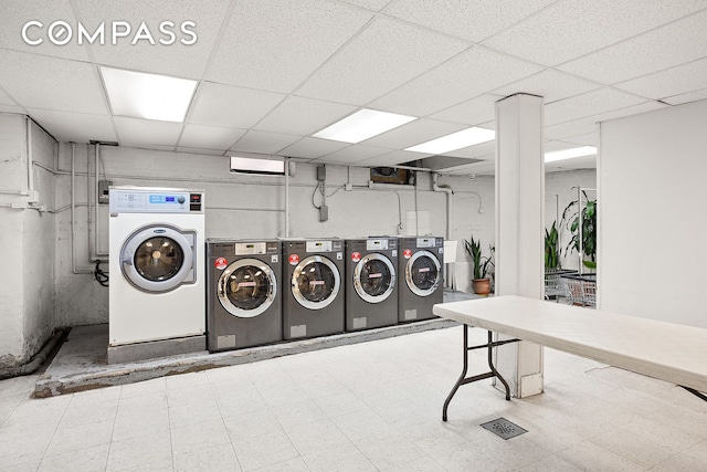 common laundry area featuring washing machine and dryer and tile patterned floors