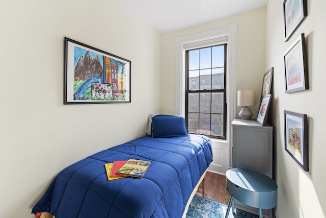 bedroom featuring wood finished floors