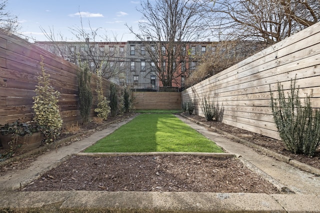 view of yard featuring a fenced backyard