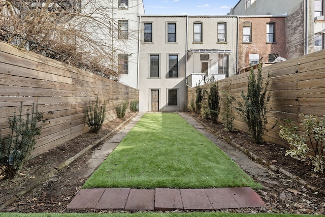 view of yard with a fenced backyard