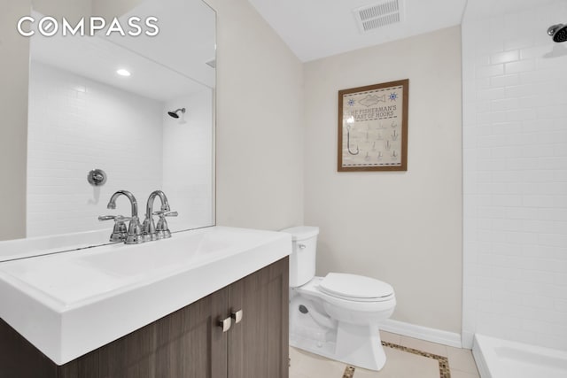 bathroom featuring visible vents, toilet, tile patterned flooring, and a tile shower