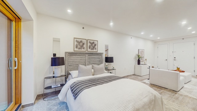 bedroom featuring light wood finished floors and recessed lighting