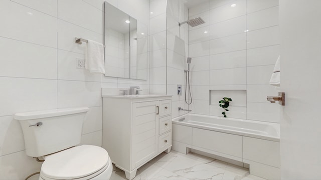 full bath featuring vanity, tiled shower / bath combo, tile walls, toilet, and marble finish floor