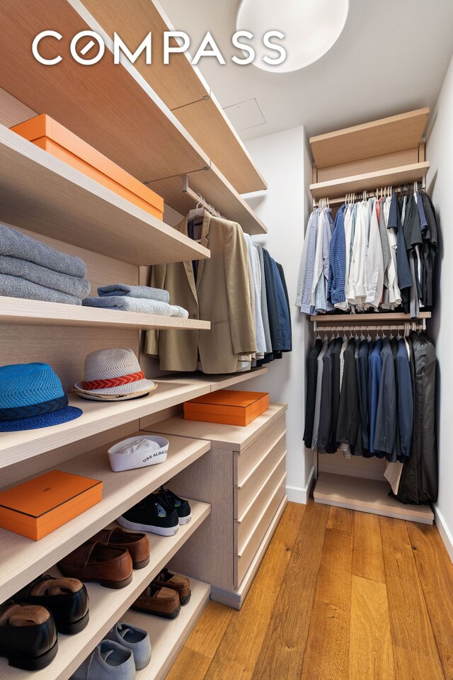 311 W Broadway Unit 5I, New York City, NY 10013 - walk in closet featuring light wood-type flooring
