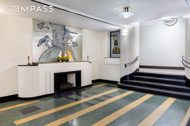 1680 Ocean Ave Unit 6D, New York City, NY 11230 - stairs with baseboards and a fireplace with flush hearth