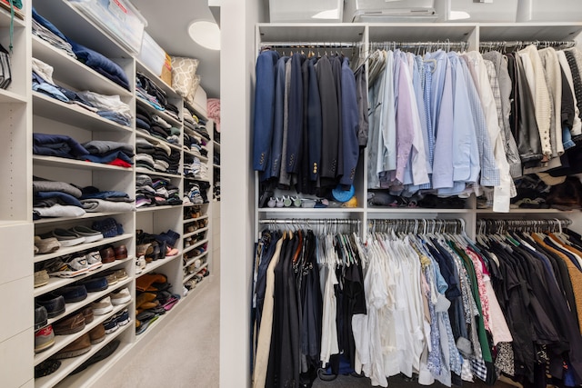 walk in closet featuring a wall mounted AC