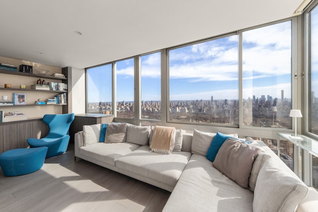 sunroom / solarium featuring a healthy amount of sunlight and a city view