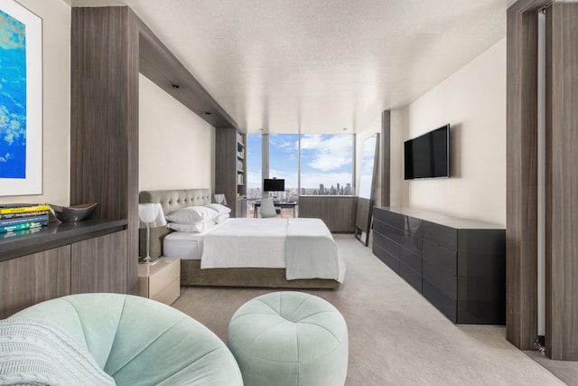 carpeted bedroom featuring a textured ceiling