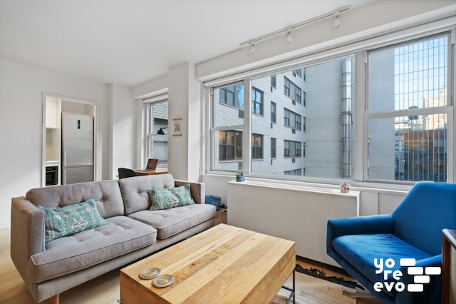 living room featuring rail lighting