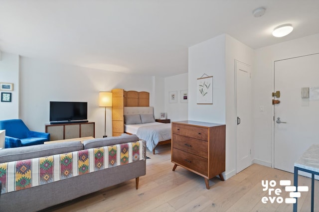 bedroom featuring light wood-style floors