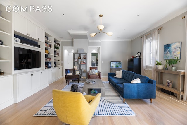 living room with light wood-style floors and crown molding