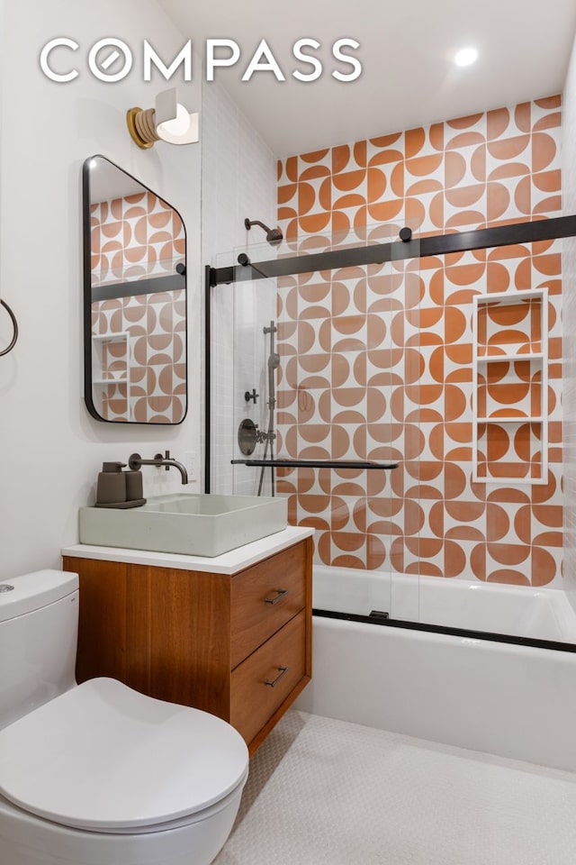 288 W 92nd St Unit 5Ade, New York City, NY 10025 - full bath featuring toilet, shower / bath combination with glass door, and vanity