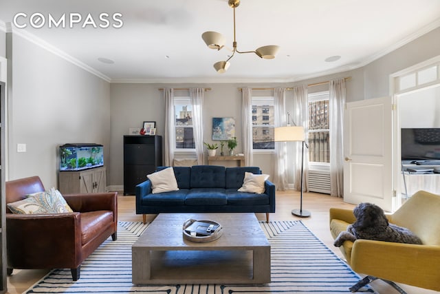 288 W 92nd St Unit 5Ade, New York City, NY 10025 - living room with ornamental molding, wood finished floors, and a chandelier