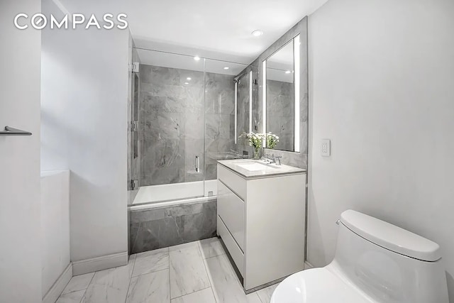 12 E 88th St Unit 6C, New York City, NY 10128 - full bathroom with marble look tile flooring, toilet, vanity, a marble finish shower, and baseboards