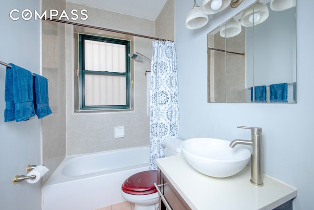 bathroom with vanity, shower / tub combo, and toilet