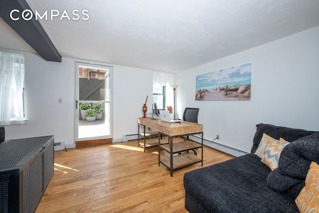 home office with light wood-style floors, baseboard heating, baseboards, and a baseboard radiator