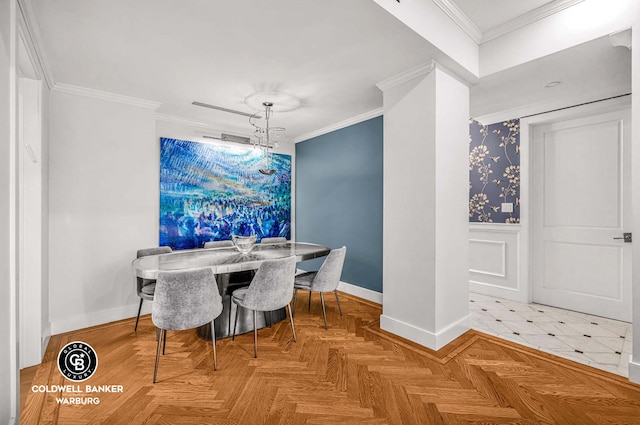 dining space with ornamental molding, a decorative wall, wainscoting, and baseboards