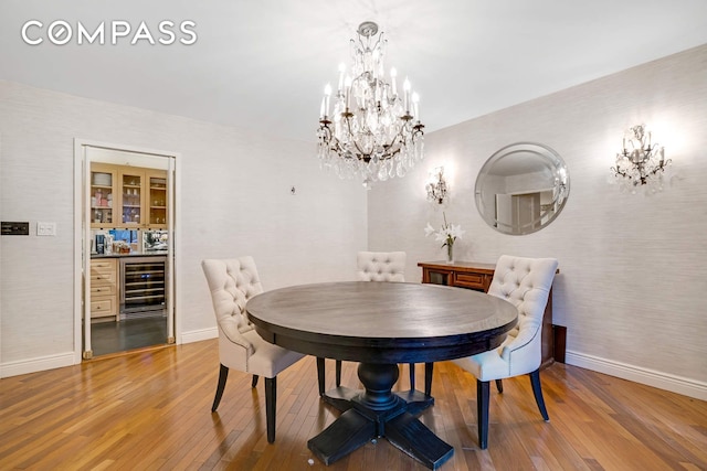 309 E 49th St Unit 2B3B, New York City, NY 10017 - dining area with beverage cooler, a chandelier, and baseboards