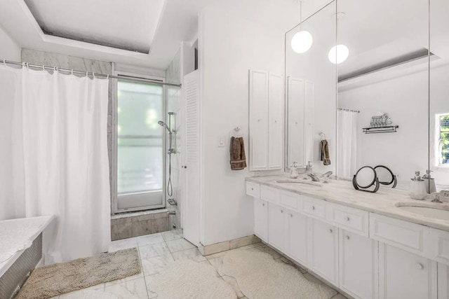 bathroom featuring a shower with curtain, marble finish floor, a sink, and double vanity