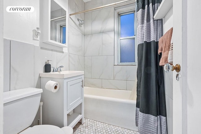 full bath with shower / tub combo, tile patterned flooring, vanity, and toilet