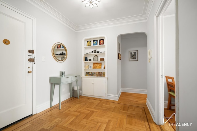 corridor featuring baseboards, arched walkways, and ornamental molding