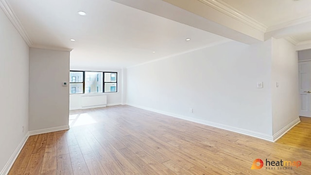 empty room featuring ornamental molding, recessed lighting, light wood-style flooring, and baseboards